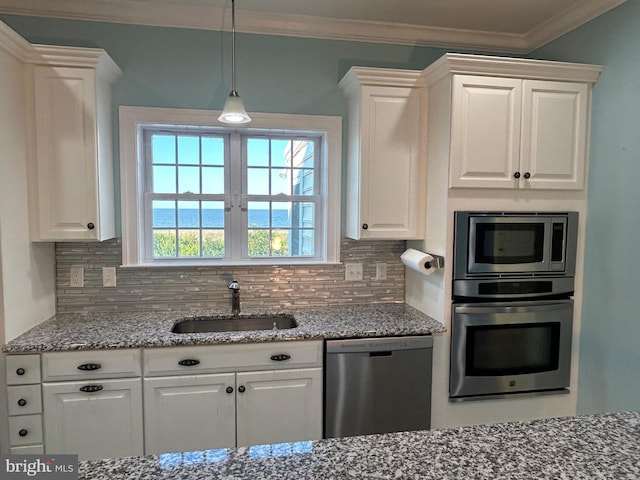 kitchen with tasteful backsplash, stainless steel appliances, crown molding, sink, and white cabinets