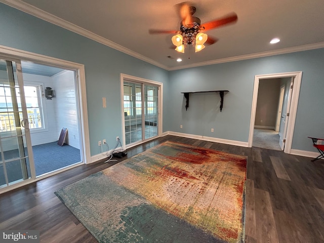 interior space with ceiling fan, dark hardwood / wood-style flooring, and ornamental molding