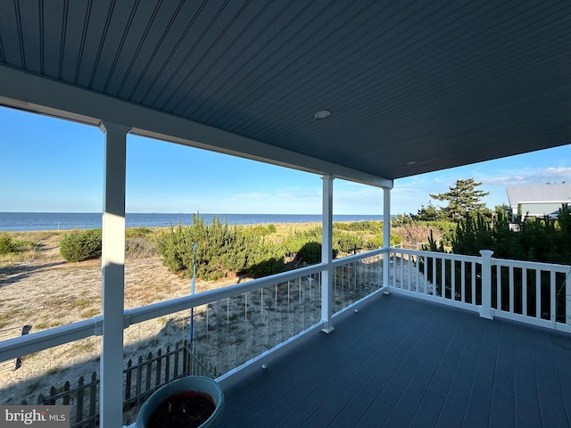 wooden deck with a water view