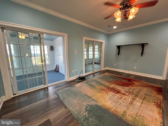 empty room with ornamental molding and dark wood-type flooring