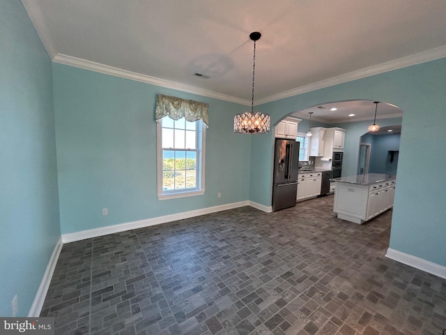 kitchen with ornamental molding, stainless steel fridge with ice dispenser, a center island, white cabinetry, and hanging light fixtures