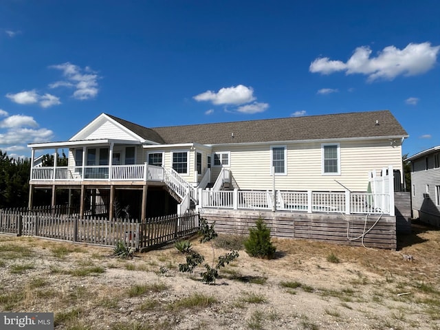 rear view of property with a deck