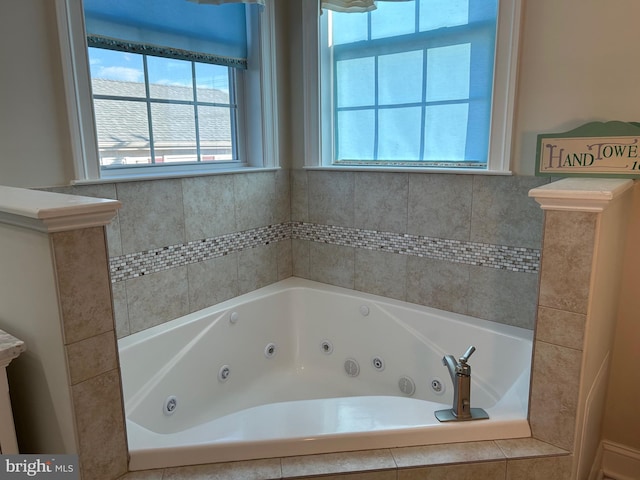 bathroom featuring tiled tub