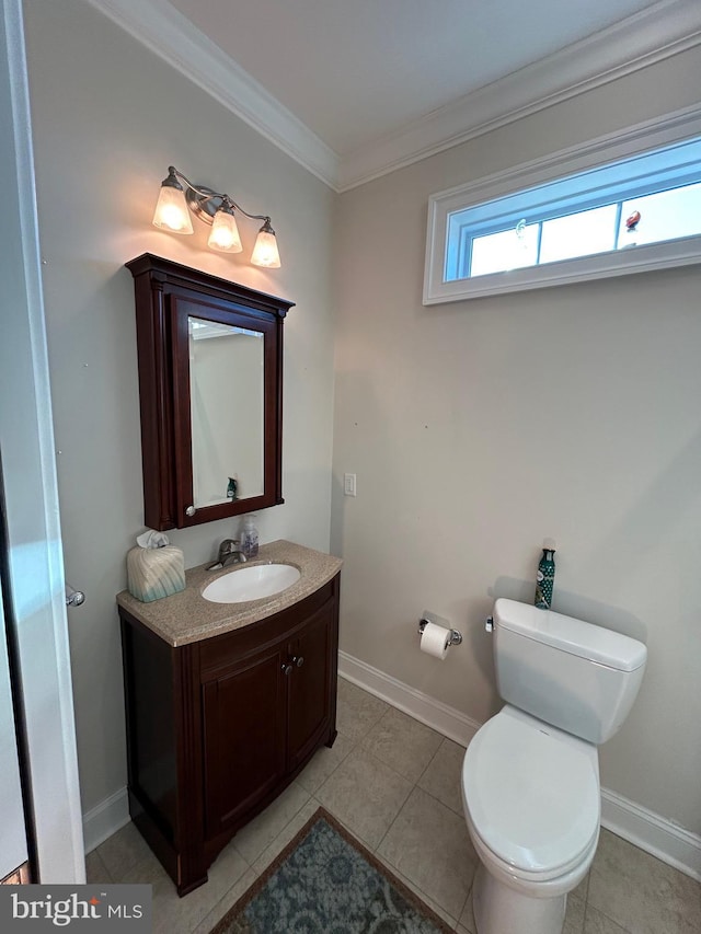 bathroom with crown molding, tile patterned flooring, vanity, and toilet