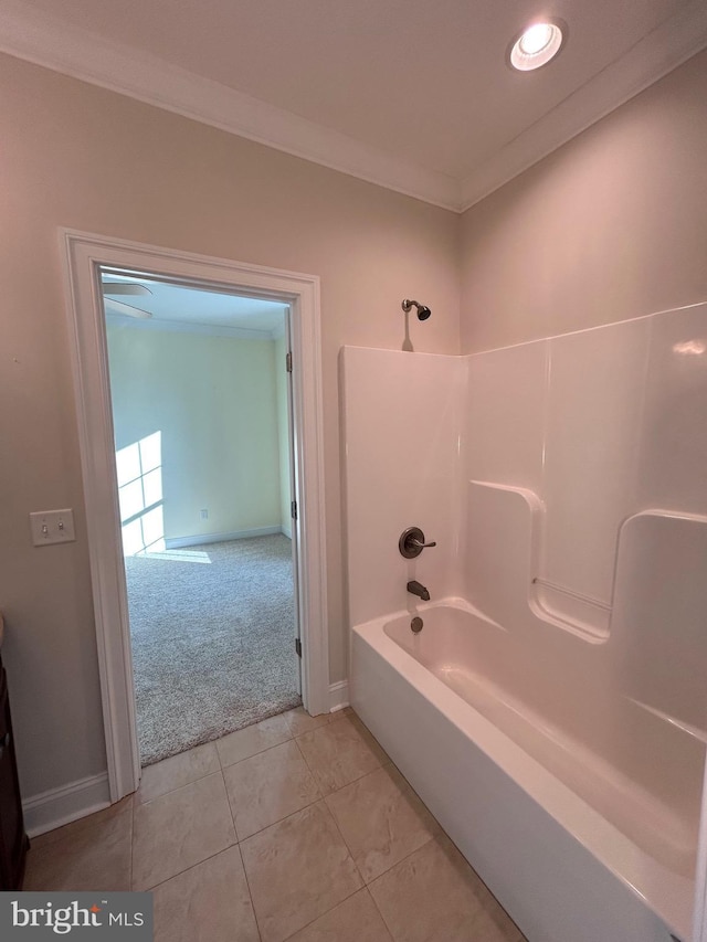 bathroom with bathtub / shower combination and ornamental molding