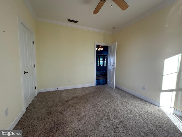 unfurnished bedroom featuring ceiling fan with notable chandelier, carpet floors, and ornamental molding