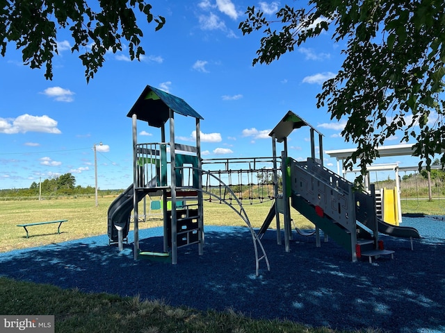 view of playground with a yard