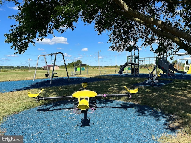 view of jungle gym featuring a lawn