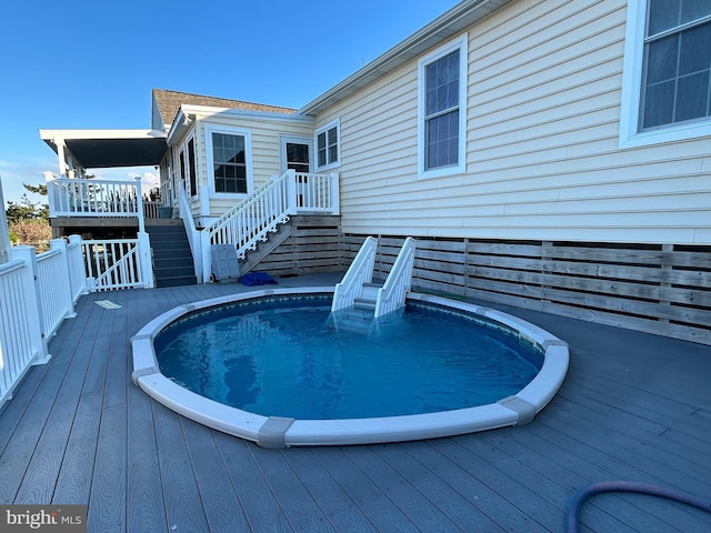 view of pool with a deck