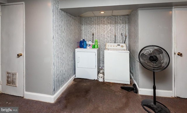 laundry room featuring dark colored carpet and washing machine and dryer