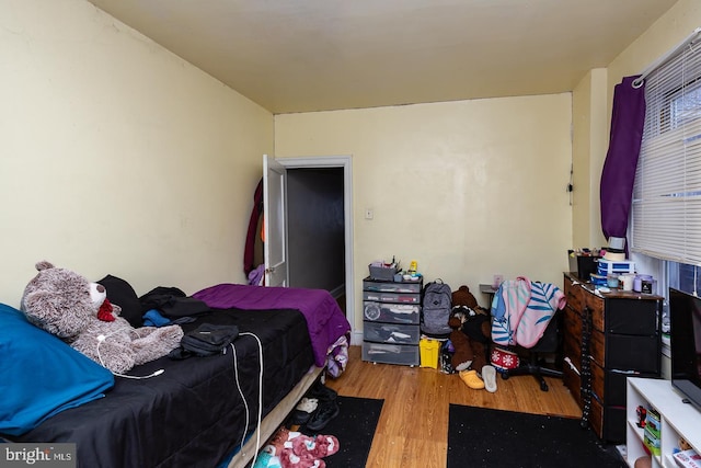 bedroom featuring wood-type flooring