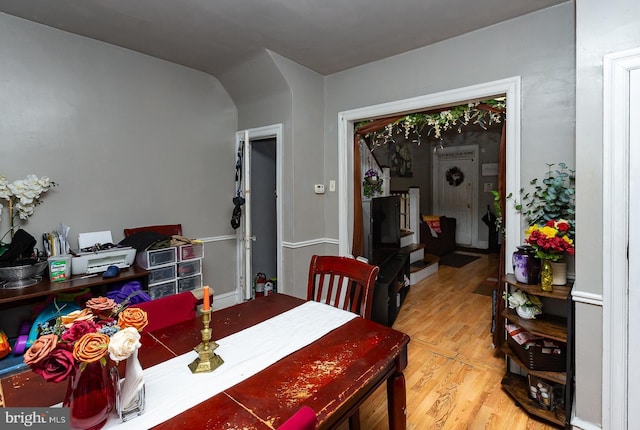 dining area with hardwood / wood-style floors