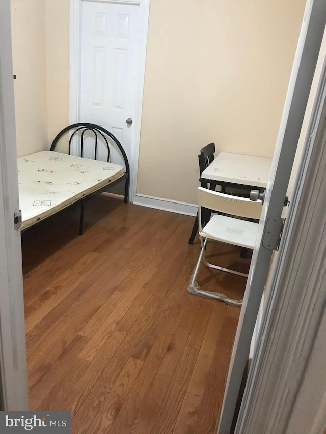 bedroom featuring hardwood / wood-style floors