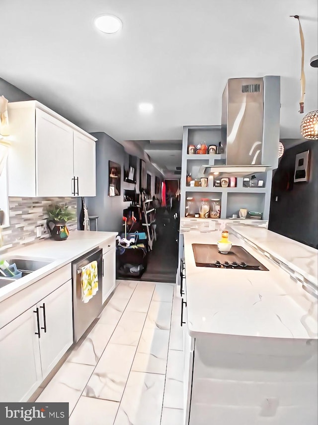 kitchen with stainless steel dishwasher, decorative backsplash, light stone countertops, and white cabinetry