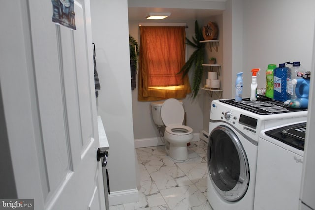 washroom with washing machine and dryer