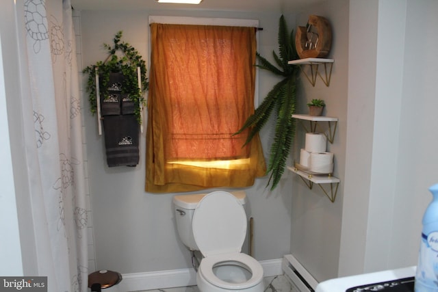 bathroom with a baseboard radiator and toilet