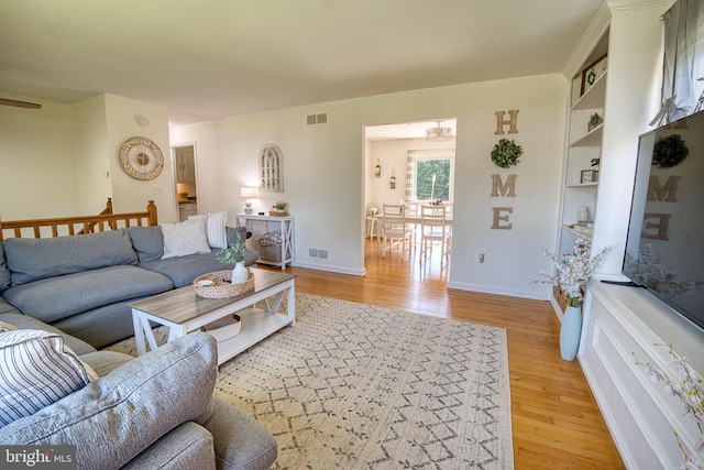 living room with light hardwood / wood-style flooring