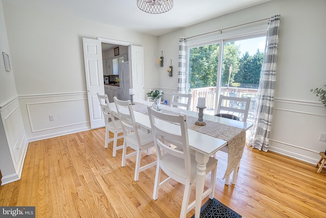 dining area with light hardwood / wood-style flooring