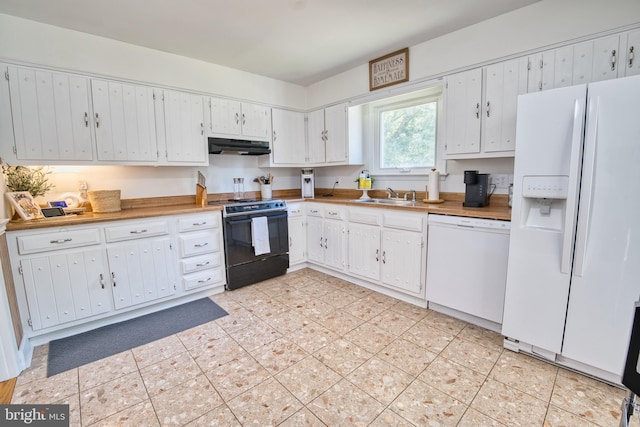 kitchen featuring white cabinetry, sink, and white appliances