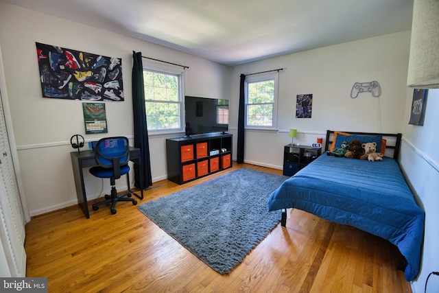 bedroom with light wood-type flooring