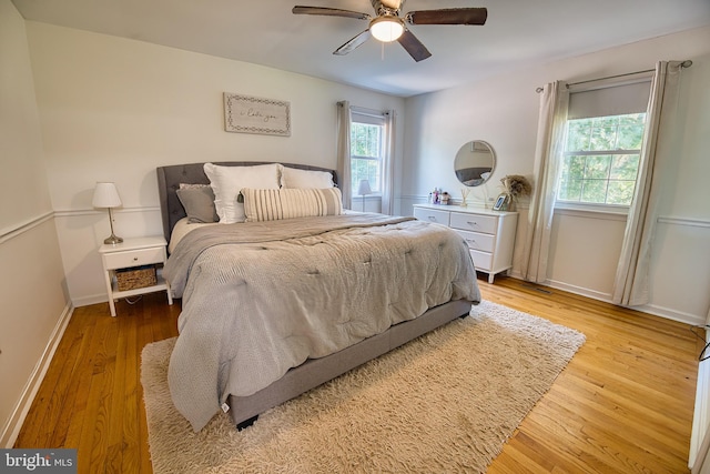 bedroom featuring ceiling fan and light hardwood / wood-style flooring