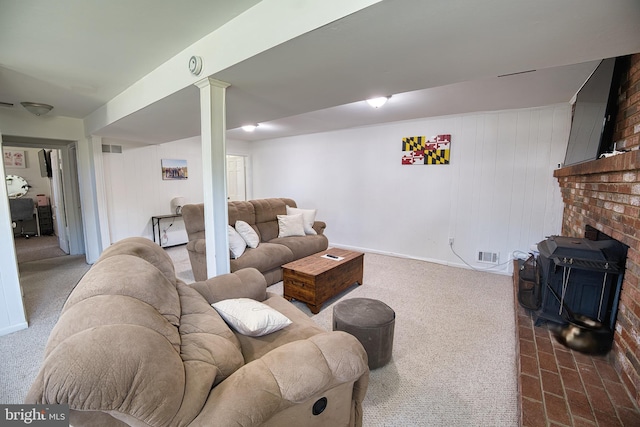 carpeted living room with wooden walls