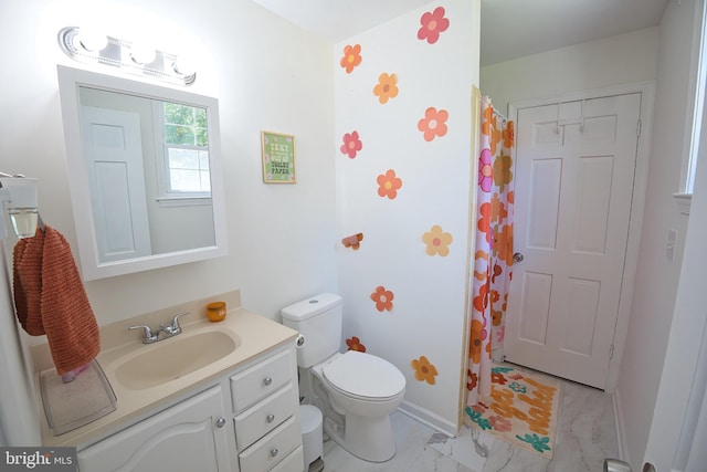 bathroom with toilet and vanity