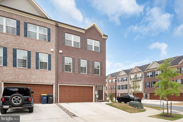 townhome / multi-family property featuring a garage