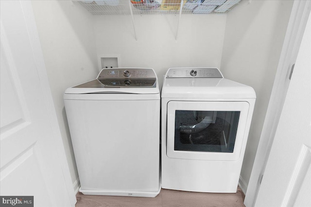 clothes washing area featuring washing machine and dryer