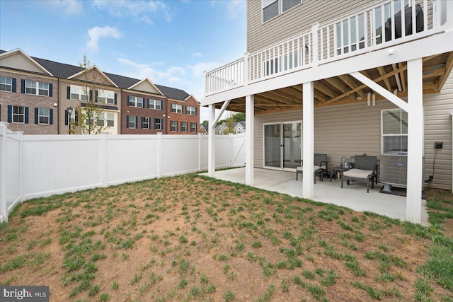 view of yard featuring a patio area and a wooden deck