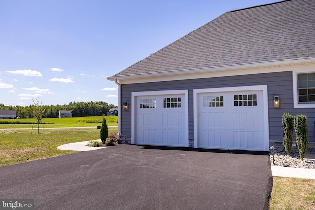 garage featuring a yard