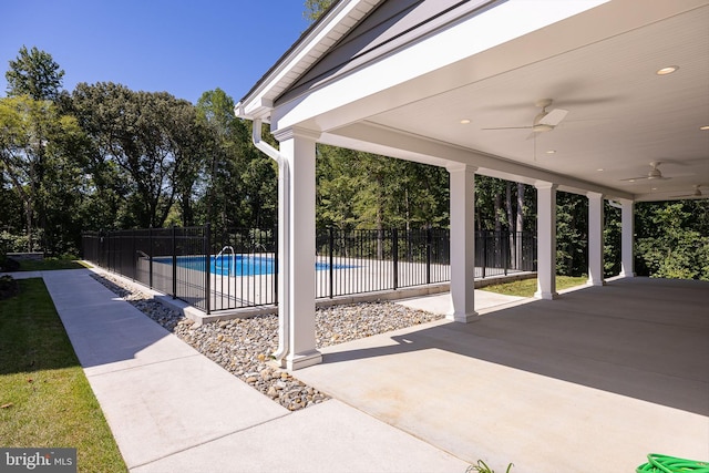 view of pool featuring ceiling fan and a patio