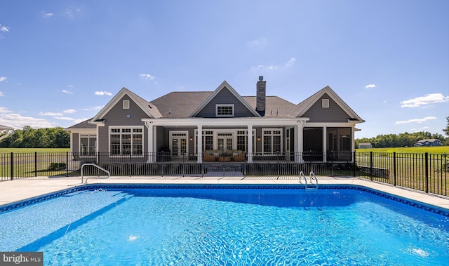 view of pool with a sunroom