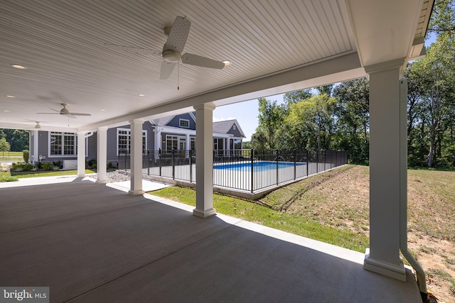 view of pool with ceiling fan, a yard, and a patio