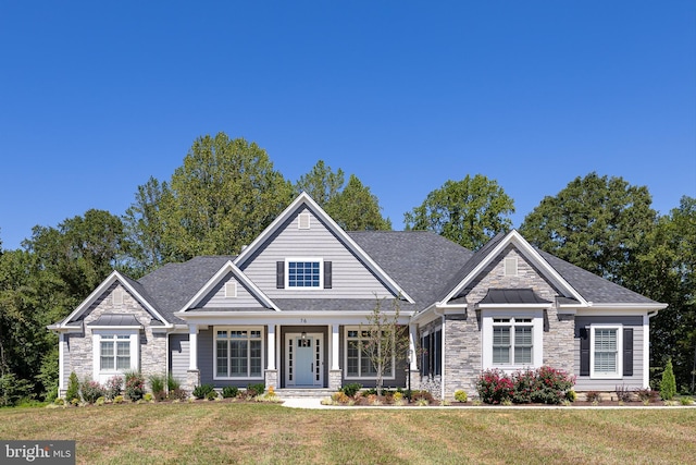 craftsman-style home featuring a front yard