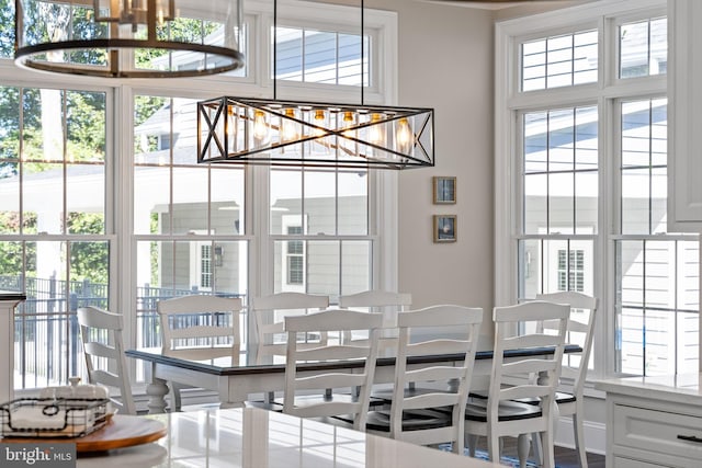 dining room with a notable chandelier and a wealth of natural light