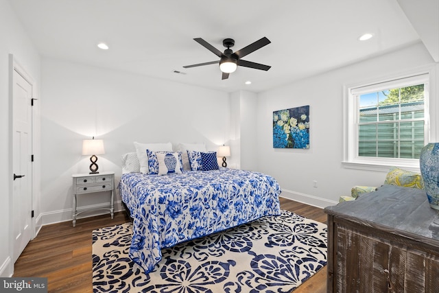 bedroom featuring dark hardwood / wood-style flooring and ceiling fan