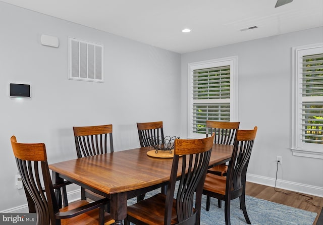 dining room with hardwood / wood-style flooring