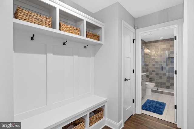 mudroom with dark hardwood / wood-style flooring