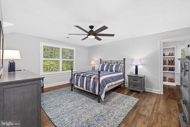 bedroom with ceiling fan and dark hardwood / wood-style flooring