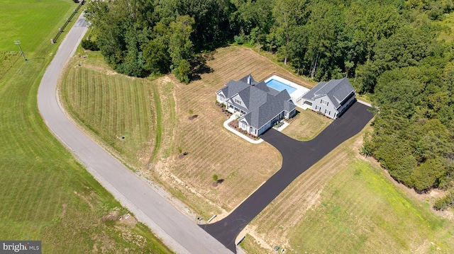 birds eye view of property with a rural view