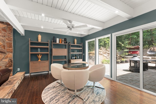 interior space with beam ceiling, hardwood / wood-style flooring, and ceiling fan