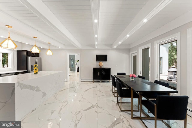 dining area with beamed ceiling, a wealth of natural light, and light tile floors