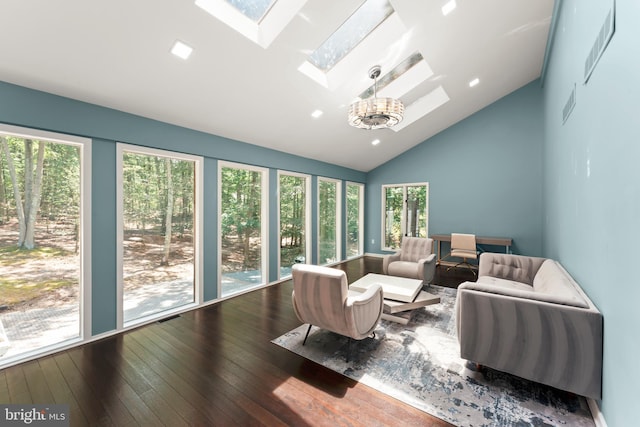 interior space featuring vaulted ceiling with skylight and a healthy amount of sunlight