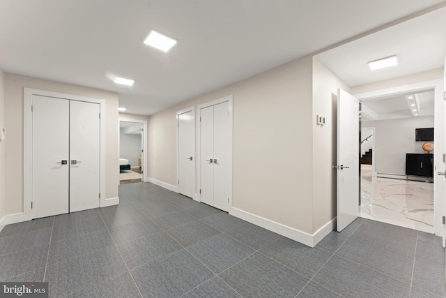 interior space featuring dark tile floors