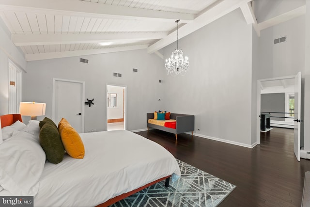 bedroom with beamed ceiling, dark hardwood / wood-style floors, a chandelier, high vaulted ceiling, and ensuite bathroom