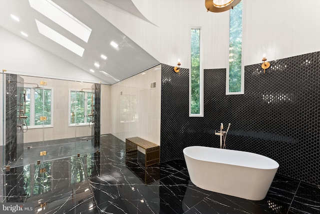 bathroom featuring tile flooring and tile walls