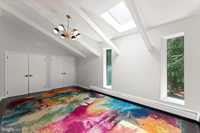 bonus room with wood-type flooring, baseboard heating, a chandelier, and lofted ceiling with skylight