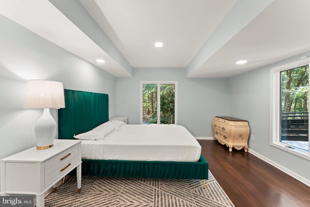 bedroom with dark wood-type flooring