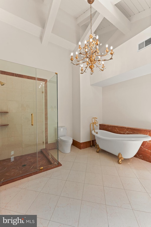 bathroom featuring tile floors, beamed ceiling, toilet, and plus walk in shower